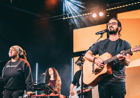 mercy hill worship service, playing guitar and singing